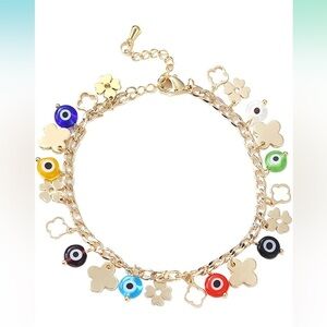Gold evil eye and four leaf clover charm bracelet